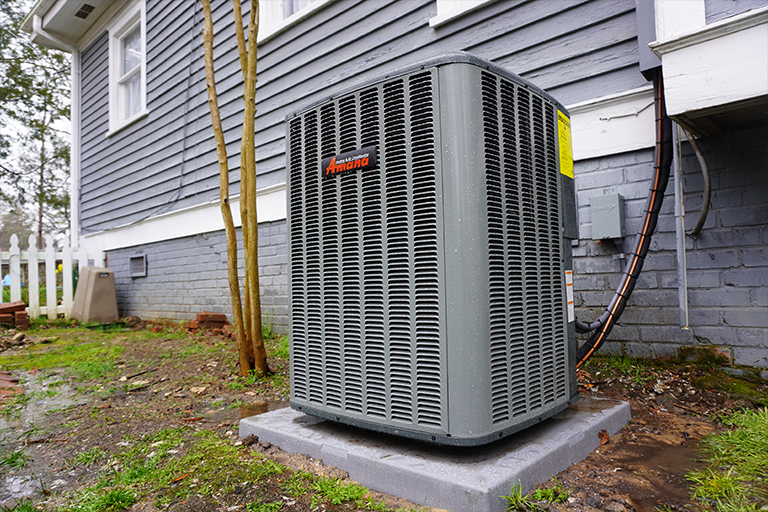 Newly installed heat pump outside a home