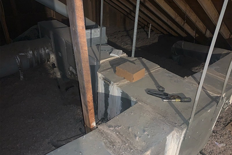 Old ductwork plenum in attic