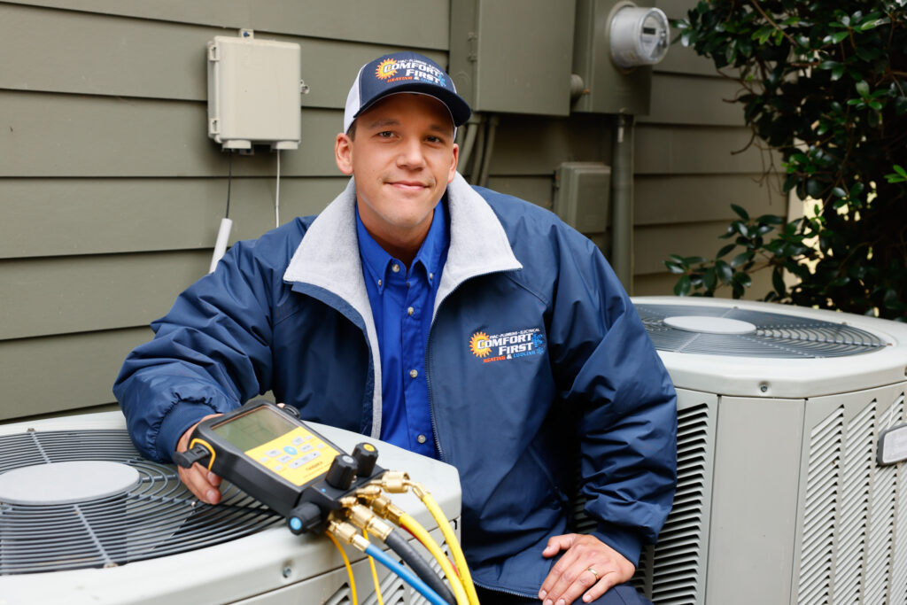 HVAC tech with AC unit