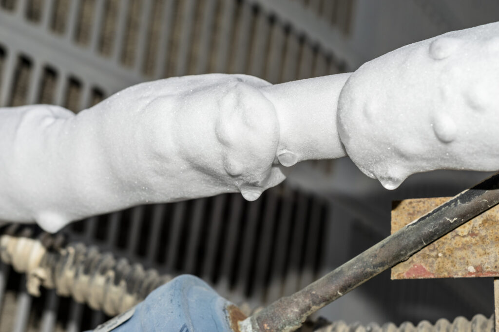 Close-up of a frozen air conditioner coil